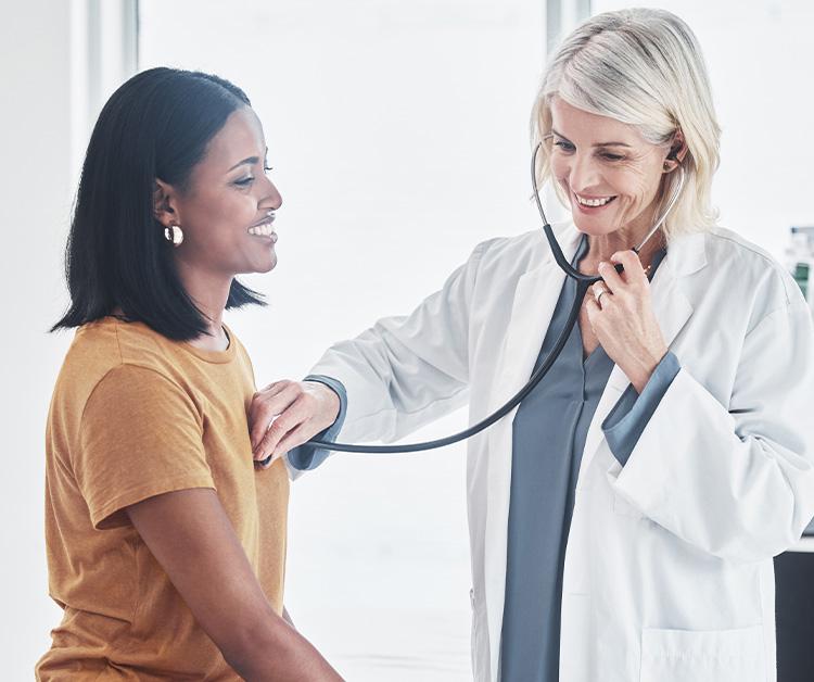 New mom receiving a checkup from her doctor