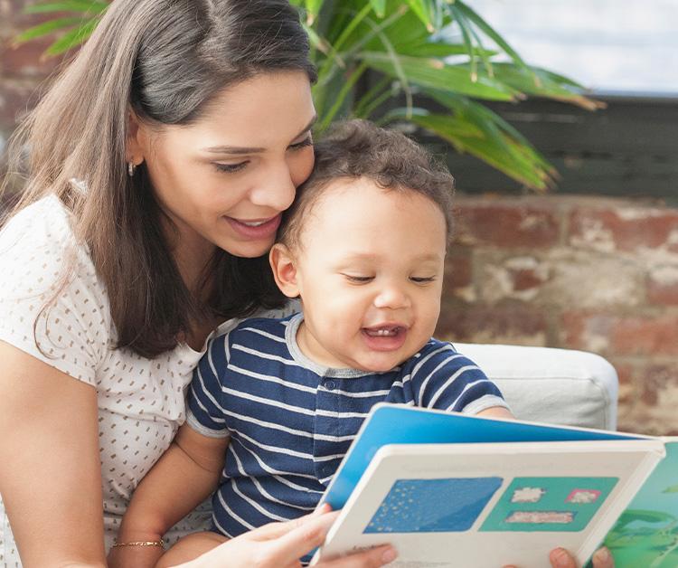 Mom reading a book to her child