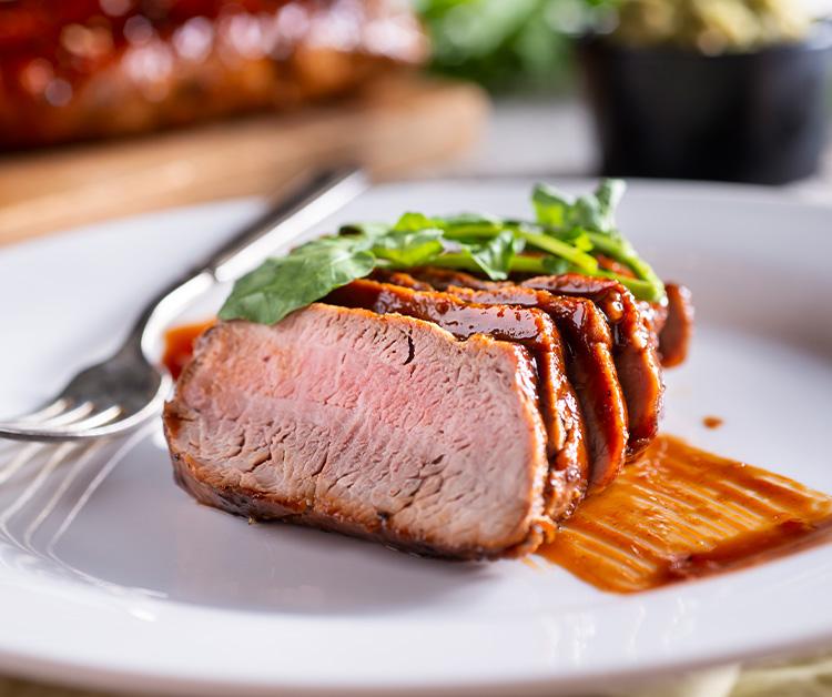 Tuscan pork with chickpeas and spinach on a plate