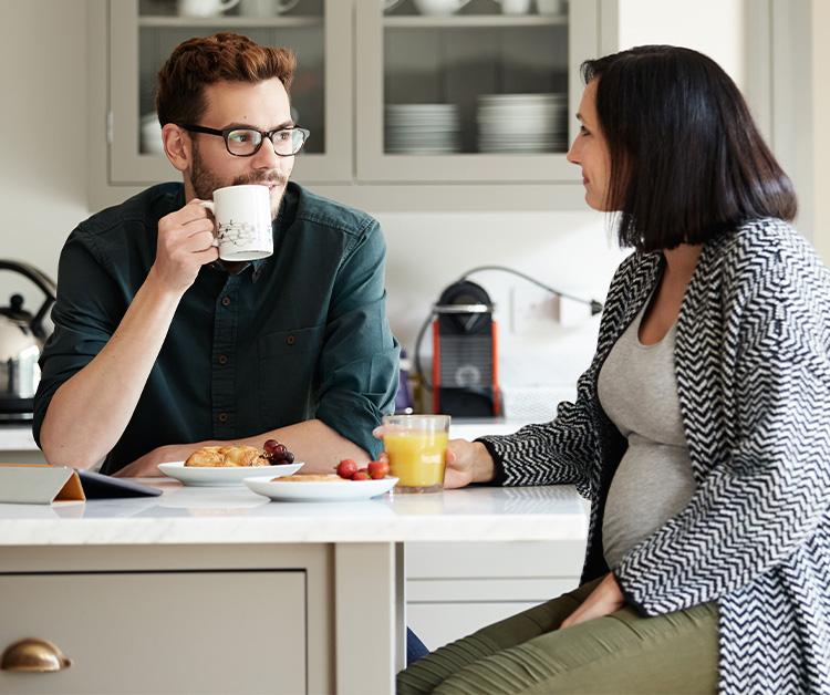 Pregnant woman talking to her partner