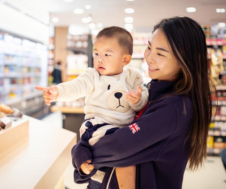 baby pointing something with his finger