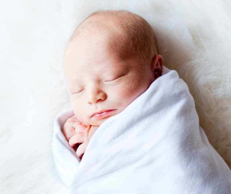 Newborn baby swaddled up
