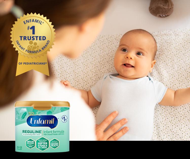 Mom laying baby on the bed