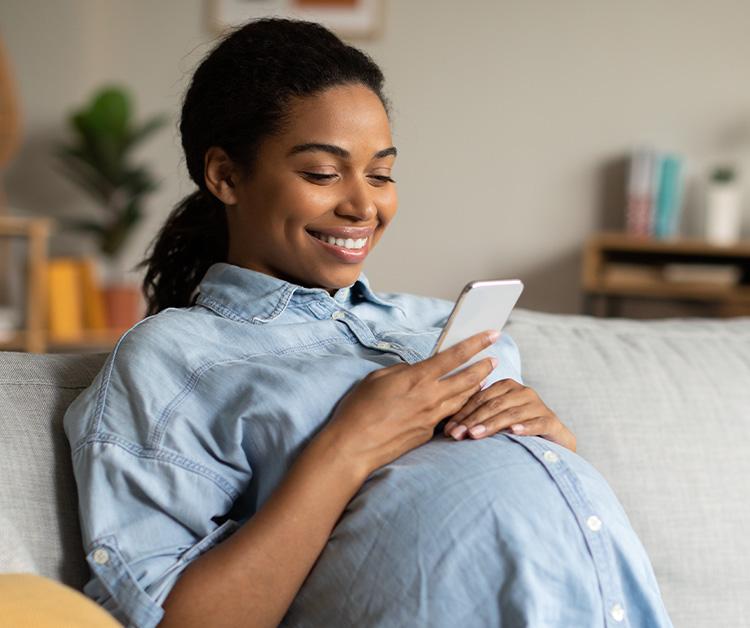 Pregnant mom looking at her phone