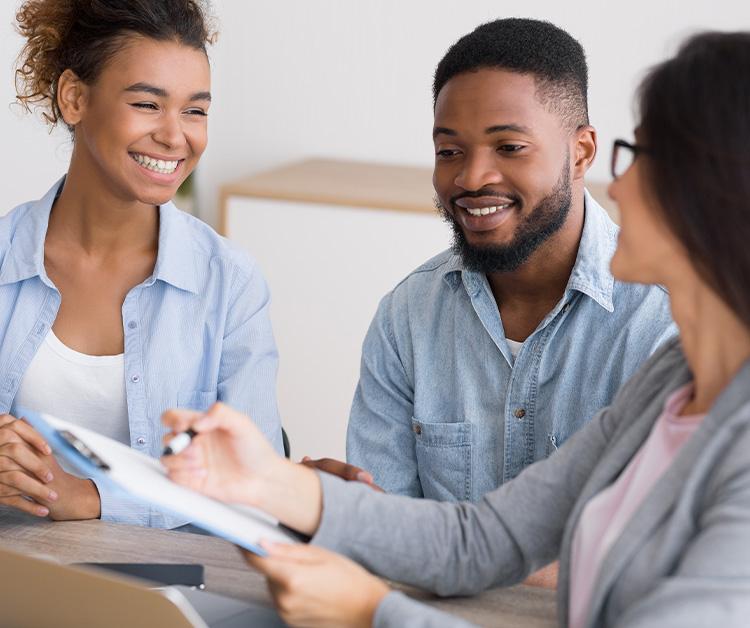Man and woman speaking with a counselor